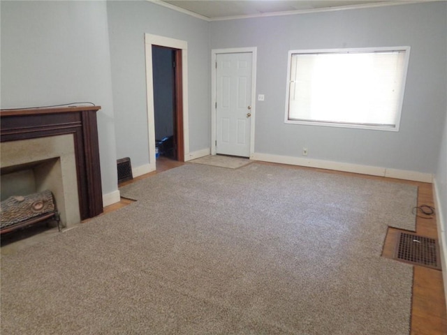 1918 S Elm St, Pittsburg, KS 66762 - unfurnished living room with crown molding and carpet floors