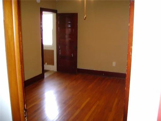 1918 S Elm St, Pittsburg, KS 66762 - unfurnished room with wood finished floors