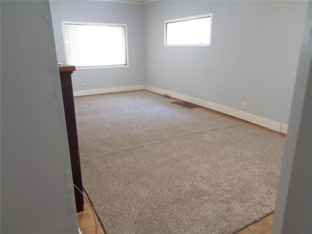 1918 S Elm St, Pittsburg, KS 66762 - unfurnished room featuring baseboards and light carpet