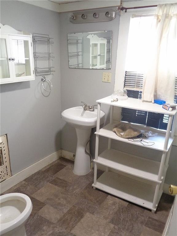1918 S Elm St, Pittsburg, KS 66762 - bathroom with baseboards and stone finish floors