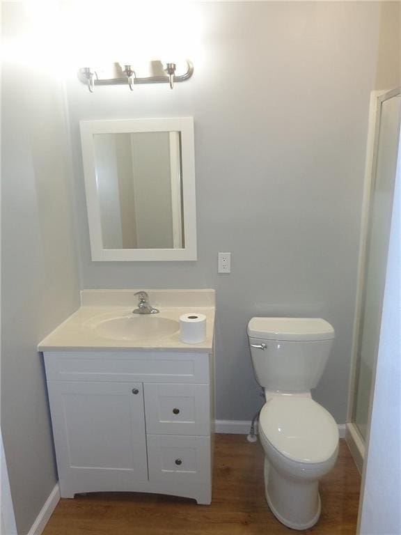 1918 S Elm St, Pittsburg, KS 66762 - bathroom featuring vanity and wood finished floors