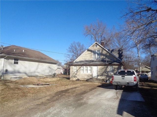 1918 S Elm St, Pittsburg, KS 66762 - view of home's exterior featuring a chimney