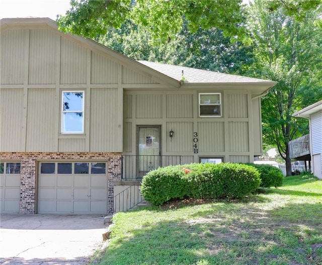 304 NE Independence Ave Unit B, Lees Summit, MO 64063 - view of front of house with driveway, brick siding, and a garage