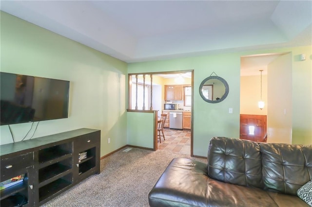304 NE Independence Ave Unit B, Lees Summit, MO 64063 - living room featuring baseboards and light carpet