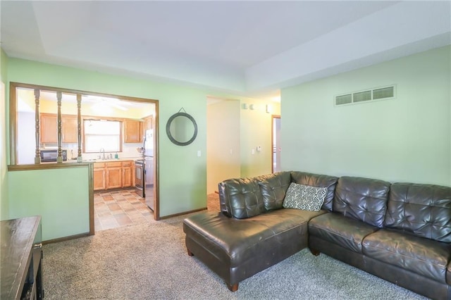 304 NE Independence Ave Unit B, Lees Summit, MO 64063 - living area featuring light carpet and baseboards
