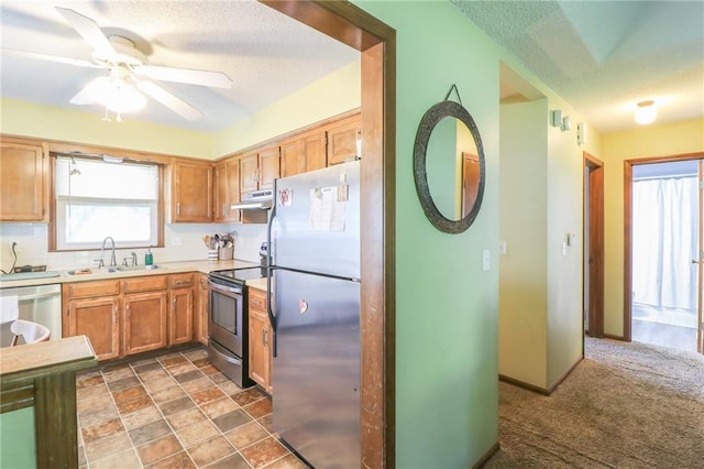 304 NE Independence Ave Unit B, Lees Summit, MO 64063 - kitchen featuring appliances with stainless steel finishes, extractor fan, a textured ceiling, light countertops, and a ceiling fan