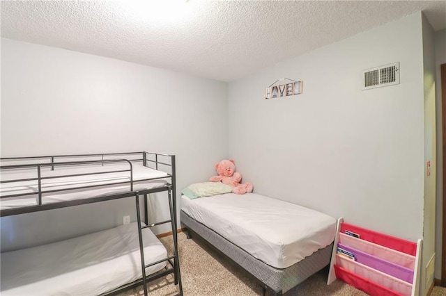 304 NE Independence Ave Unit B, Lees Summit, MO 64063 - carpeted bedroom featuring a textured ceiling
