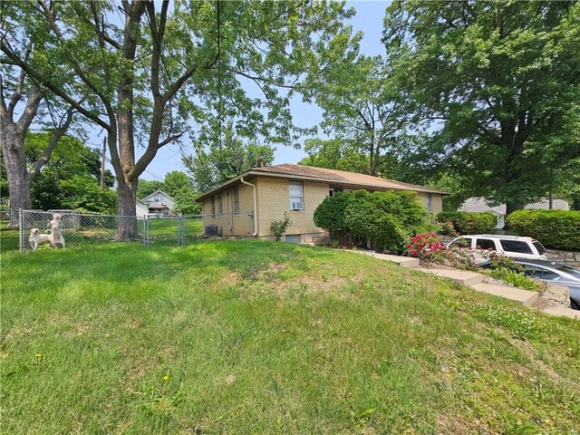 524 E Walnut St, Independence, MO 64050 - view of home's exterior featuring brick siding