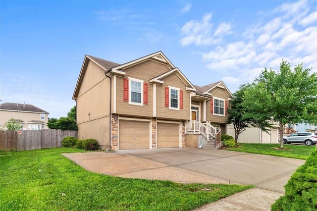 610 NW Green Dr, Grain Valley, MO 64029 - bi-level home with a garage, driveway, and stone siding