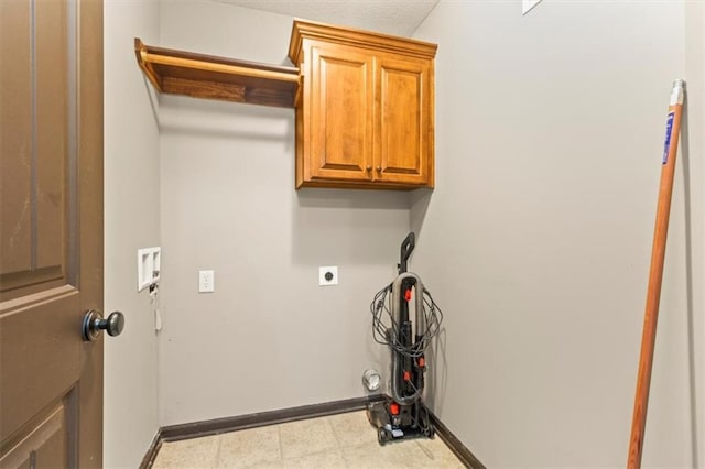 610 NW Green Dr, Grain Valley, MO 64029 - laundry room featuring hookup for an electric dryer, hookup for a washing machine, and cabinet space