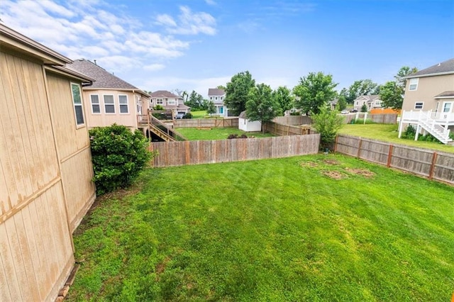 610 NW Green Dr, Grain Valley, MO 64029 - fenced backyard featuring a residential view