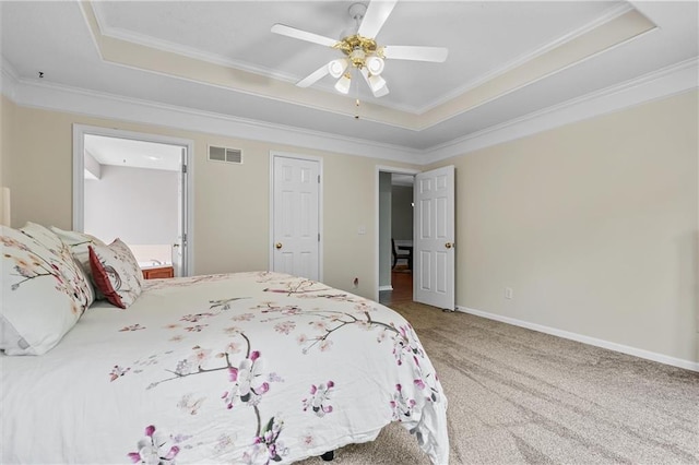 4116 NE 83rd St, Kansas City, MO 64119 - carpeted bedroom featuring a tray ceiling, crown molding, and a ceiling fan