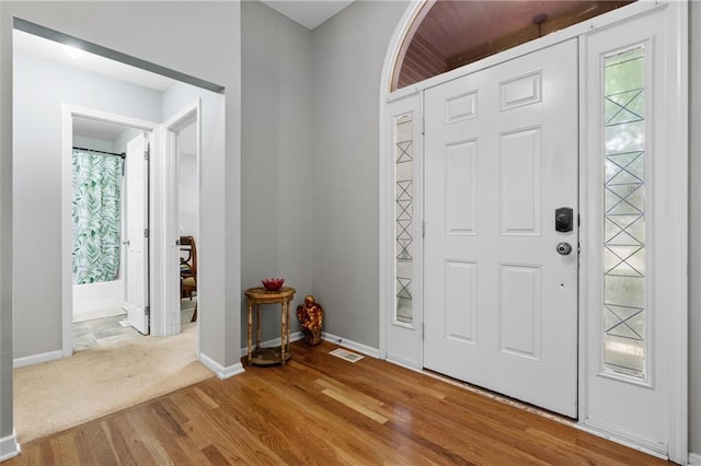 4116 NE 83rd St, Kansas City, MO 64119 - entrance foyer featuring plenty of natural light and wood finished floors