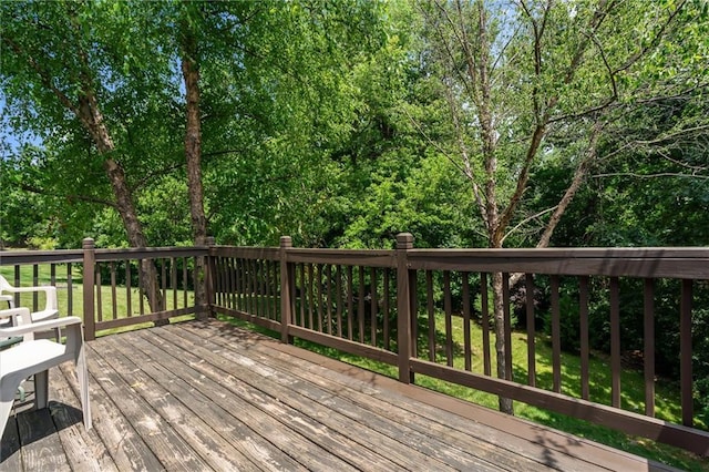4116 NE 83rd St, Kansas City, MO 64119 - wooden deck with view of scattered trees