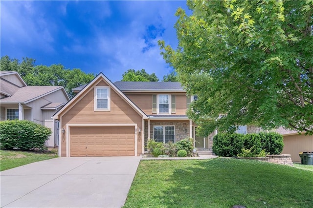 404 Wyndham Dr, Lansing, KS 66043 - view of front of property with concrete driveway, a front yard, a garage, and stone siding