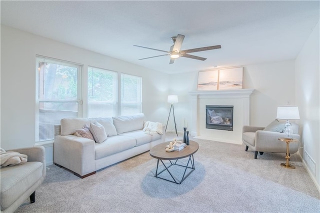404 Wyndham Dr, Lansing, KS 66043 - living room featuring carpet, ceiling fan, and a glass covered fireplace