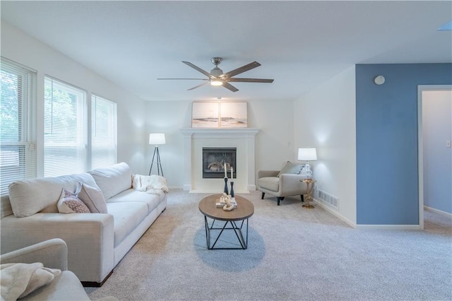 404 Wyndham Dr, Lansing, KS 66043 - living room featuring carpet, a glass covered fireplace, and ceiling fan