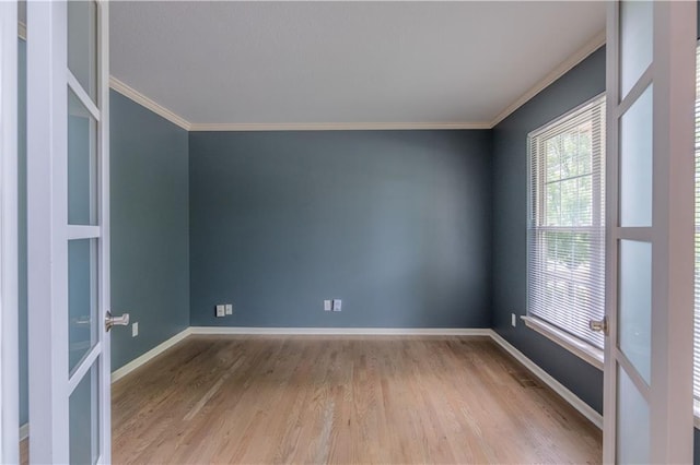 404 Wyndham Dr, Lansing, KS 66043 - unfurnished room featuring ornamental molding and wood finished floors