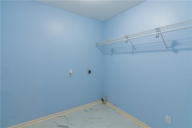 404 Wyndham Dr, Lansing, KS 66043 - laundry room with hookup for an electric dryer and marble finish flooring