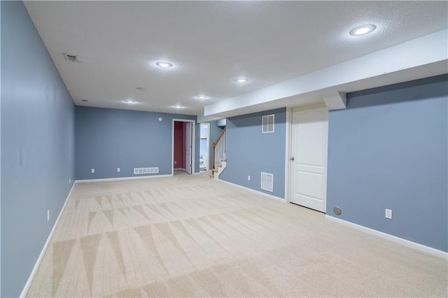 404 Wyndham Dr, Lansing, KS 66043 - finished basement featuring stairway, recessed lighting, and carpet