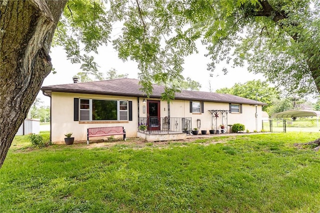 3722 Robinson Pike Rd, Grandview, MO 64030 - rear view of property featuring a carport and stucco siding
