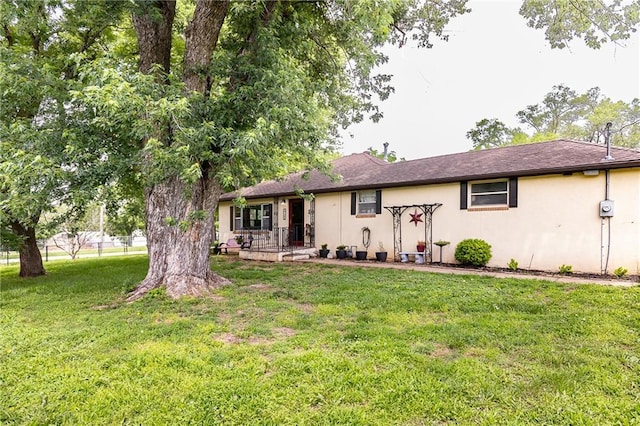 3722 Robinson Pike Rd, Grandview, MO 64030 - ranch-style house with stucco siding and a front yard