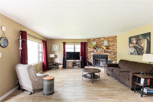 3722 Robinson Pike Rd, Grandview, MO 64030 - living area featuring wood finished floors and a fireplace