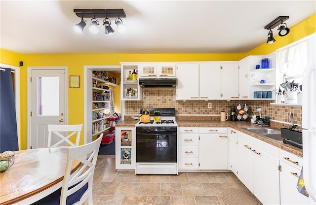 3722 Robinson Pike Rd, Grandview, MO 64030 - kitchen featuring range with gas cooktop, open shelves, under cabinet range hood, and decorative backsplash