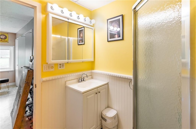 3722 Robinson Pike Rd, Grandview, MO 64030 - full bath with a wainscoted wall, vanity, and a stall shower
