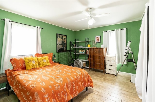 3722 Robinson Pike Rd, Grandview, MO 64030 - bedroom featuring multiple windows, wood finished floors, and ceiling fan