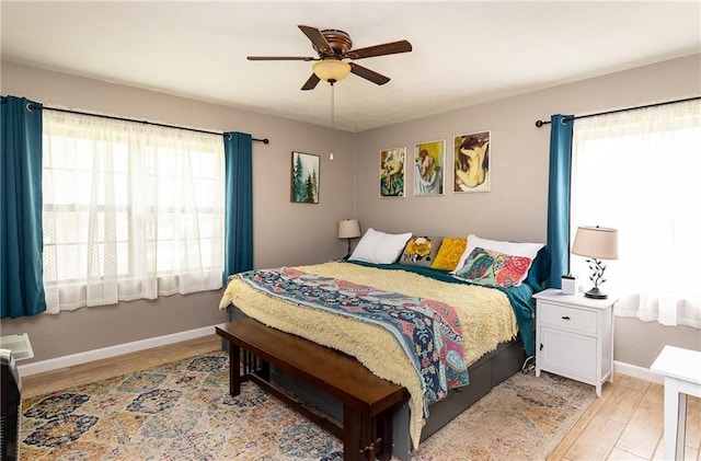 3722 Robinson Pike Rd, Grandview, MO 64030 - bedroom with light wood-type flooring and ceiling fan