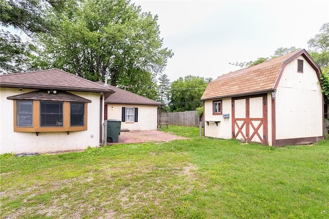 3722 Robinson Pike Rd, Grandview, MO 64030 - view of yard with a storage unit and a patio area