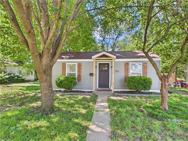 307 E 4th St, Holden, MO 64040 - view of front of home featuring a front yard