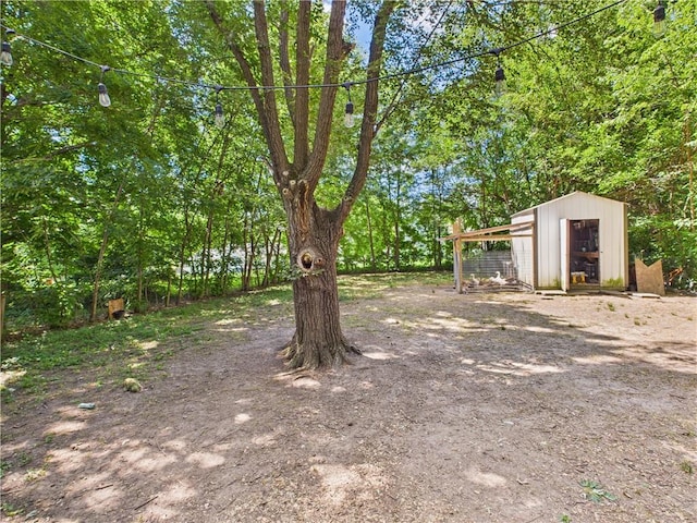 307 E 4th St, Holden, MO 64040 - view of yard with an outbuilding and exterior structure