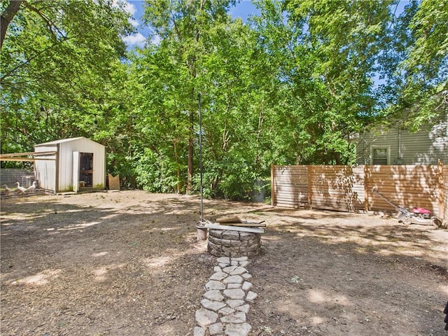 307 E 4th St, Holden, MO 64040 - view of yard featuring a storage shed