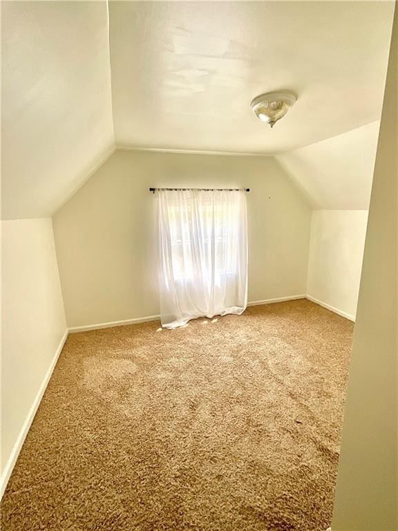 1870 N 27th St, Kansas City, KS 66104 - additional living space featuring lofted ceiling and carpet floors