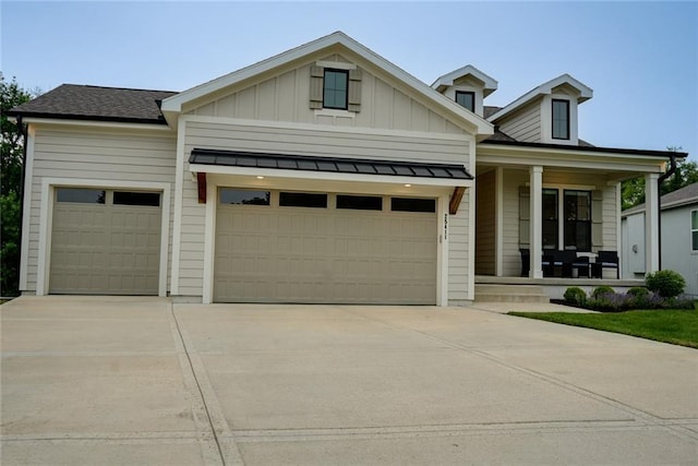 25411 W 142nd Pl, Olathe, KS 66061 - view of front of home featuring covered porch, an attached garage, concrete driveway, and board and batten siding