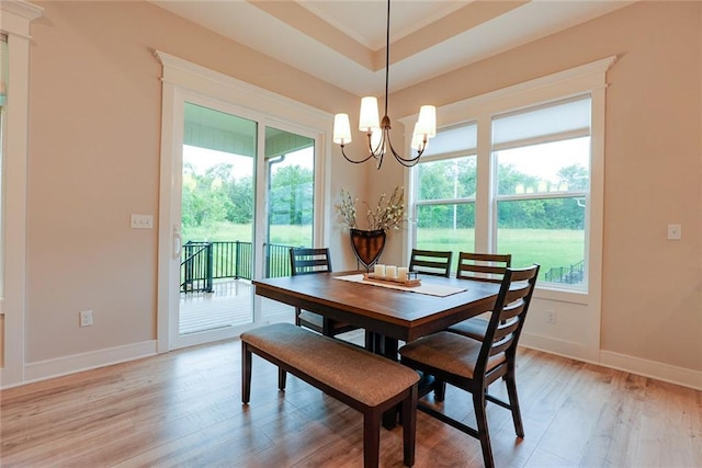 25411 W 142nd Pl, Olathe, KS 66061 - dining space with a chandelier, light wood-style floors, and healthy amount of natural light