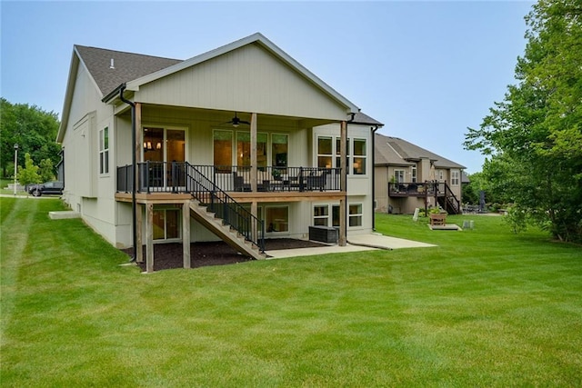 25411 W 142nd Pl, Olathe, KS 66061 - back of property with stairs, a ceiling fan, a deck, and a yard