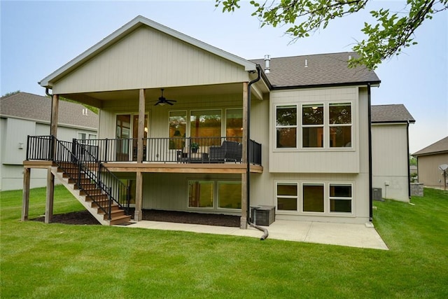 25411 W 142nd Pl, Olathe, KS 66061 - back of property featuring a ceiling fan, a patio, stairway, a lawn, and roof with shingles