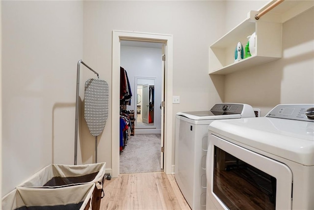 25411 W 142nd Pl, Olathe, KS 66061 - laundry room featuring washer and dryer and light wood-type flooring