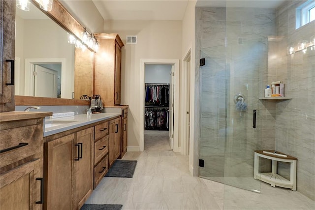 25411 W 142nd Pl, Olathe, KS 66061 - bathroom with double vanity, a shower stall, a spacious closet, and marble finish flooring
