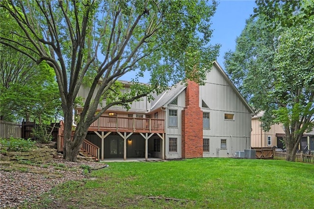 9602 W 116th St, Overland Park, KS 66210 - rear view of property featuring a wooden deck, a patio, stairway, and board and batten siding