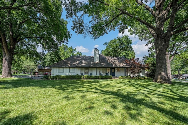 3818 W 52nd Ter, Roeland Park, KS 66205 - back of house featuring a chimney and a yard