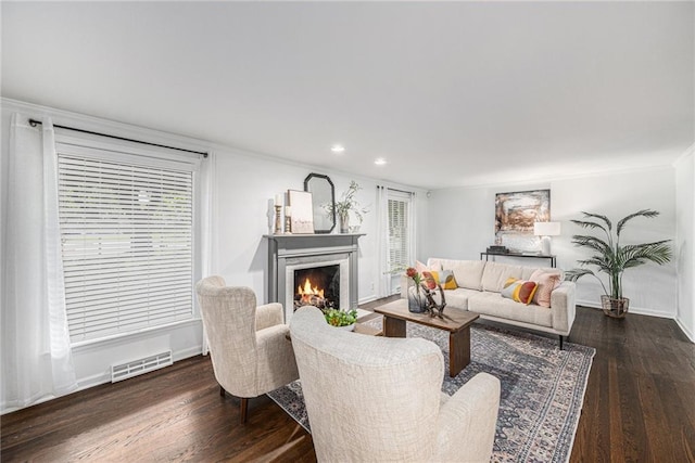 3818 W 52nd Ter, Roeland Park, KS 66205 - living area with wood finished floors, a lit fireplace, recessed lighting, and healthy amount of natural light