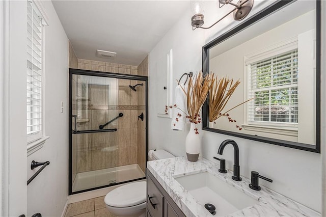 3818 W 52nd Ter, Roeland Park, KS 66205 - full bathroom with vanity, a stall shower, and tile patterned flooring
