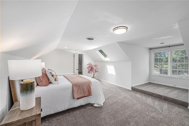 3818 W 52nd Ter, Roeland Park, KS 66205 - carpeted bedroom featuring multiple windows, vaulted ceiling, and a skylight