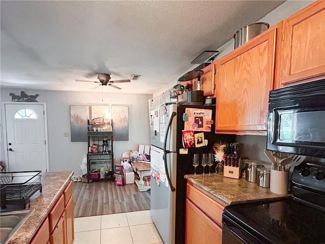 21 Oak Crest Dr, Linn Valley, KS 66040 - kitchen with black appliances, ceiling fan, and light tile patterned flooring