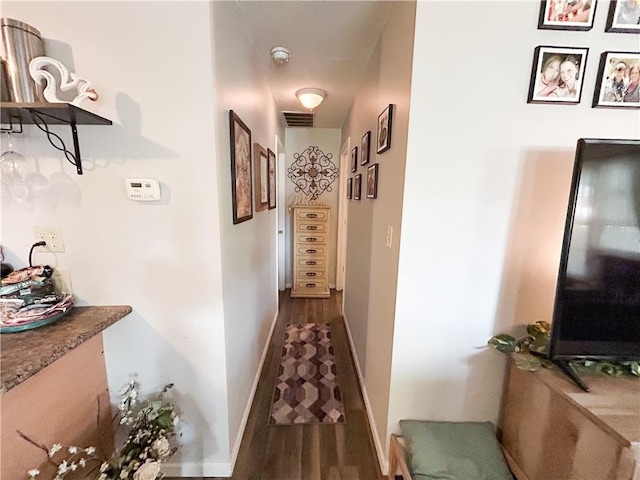 21 Oak Crest Dr, Linn Valley, KS 66040 - hallway featuring dark wood-style flooring and baseboards
