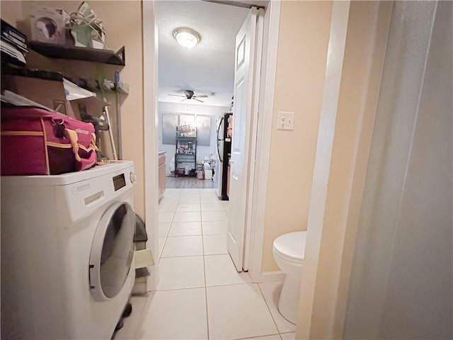 21 Oak Crest Dr, Linn Valley, KS 66040 - laundry room with washer / dryer, light tile patterned floors, and ceiling fan